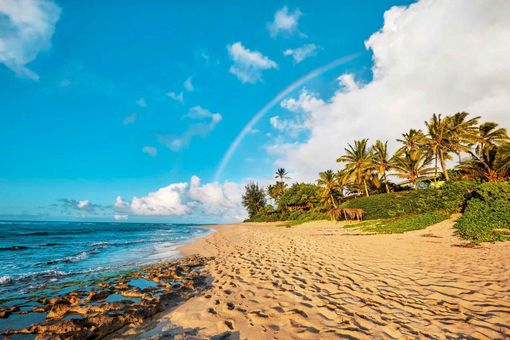 rainbow scenic view over the popular surfing place sunset beach north shore oahu